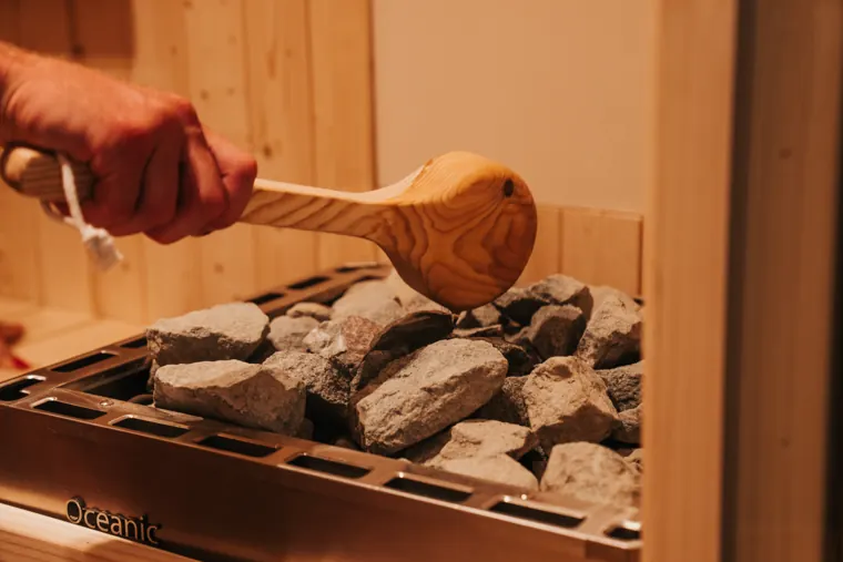 Sauna stove with stones at Spa Elite